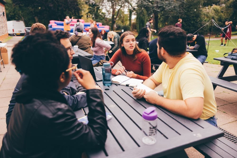 Students enjoying the sun at our East 15 campus in Loughton